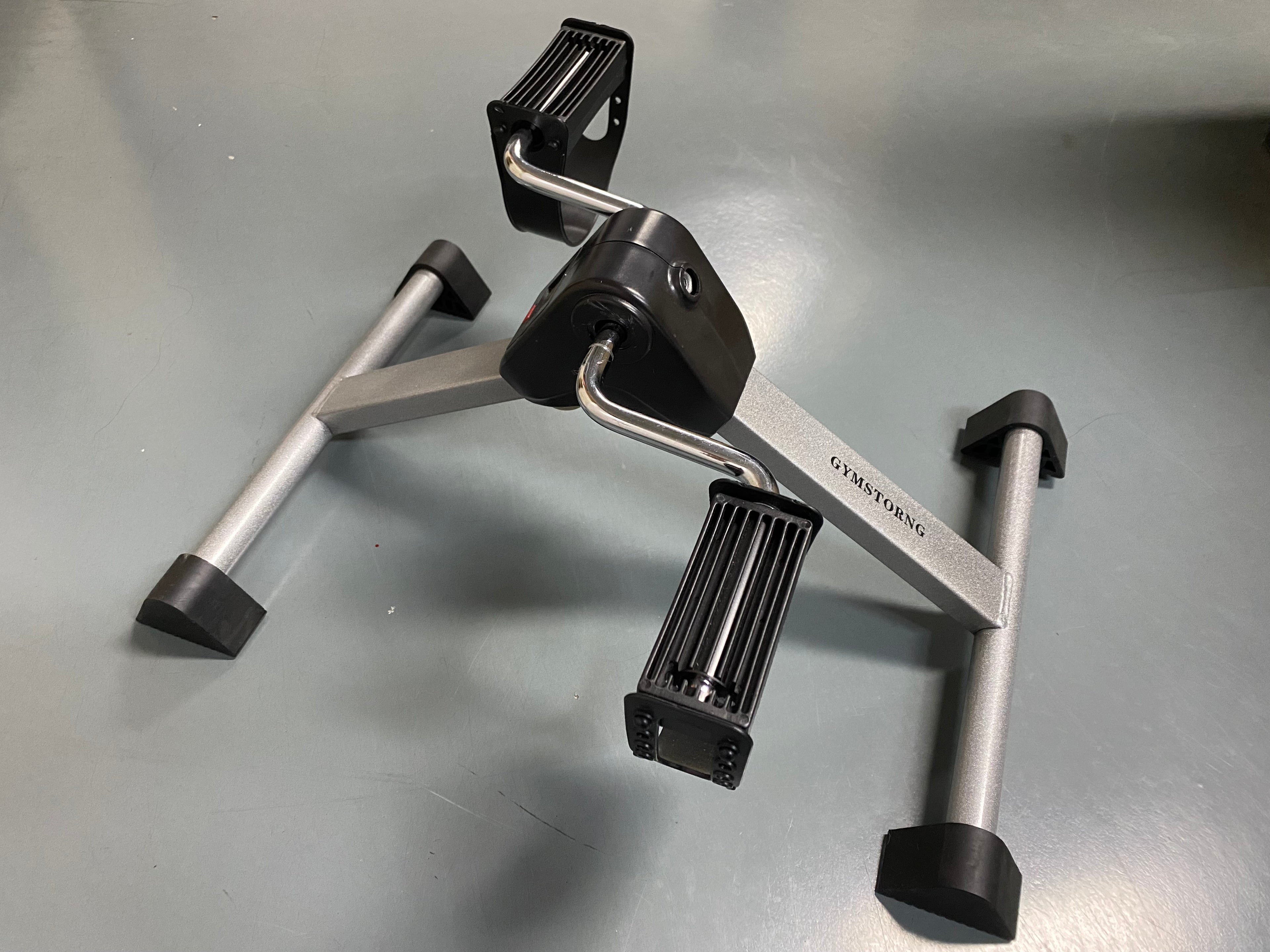 GYMSTORNG Manually-operated exercise equipment Under Desk Bike Pedal Exerciser for Legs and Arms Workout (Fully Assembled Folding Exercise Pedaler)